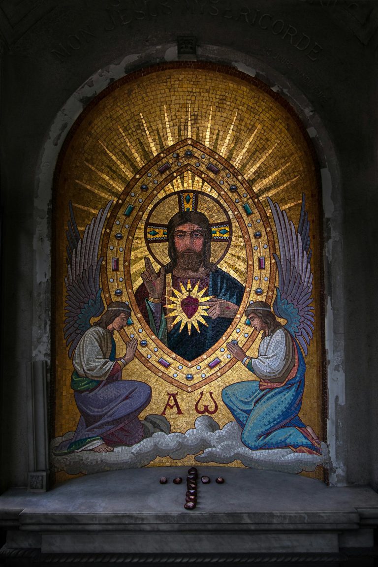 a mosaic of jesus surrounded by angels in a church