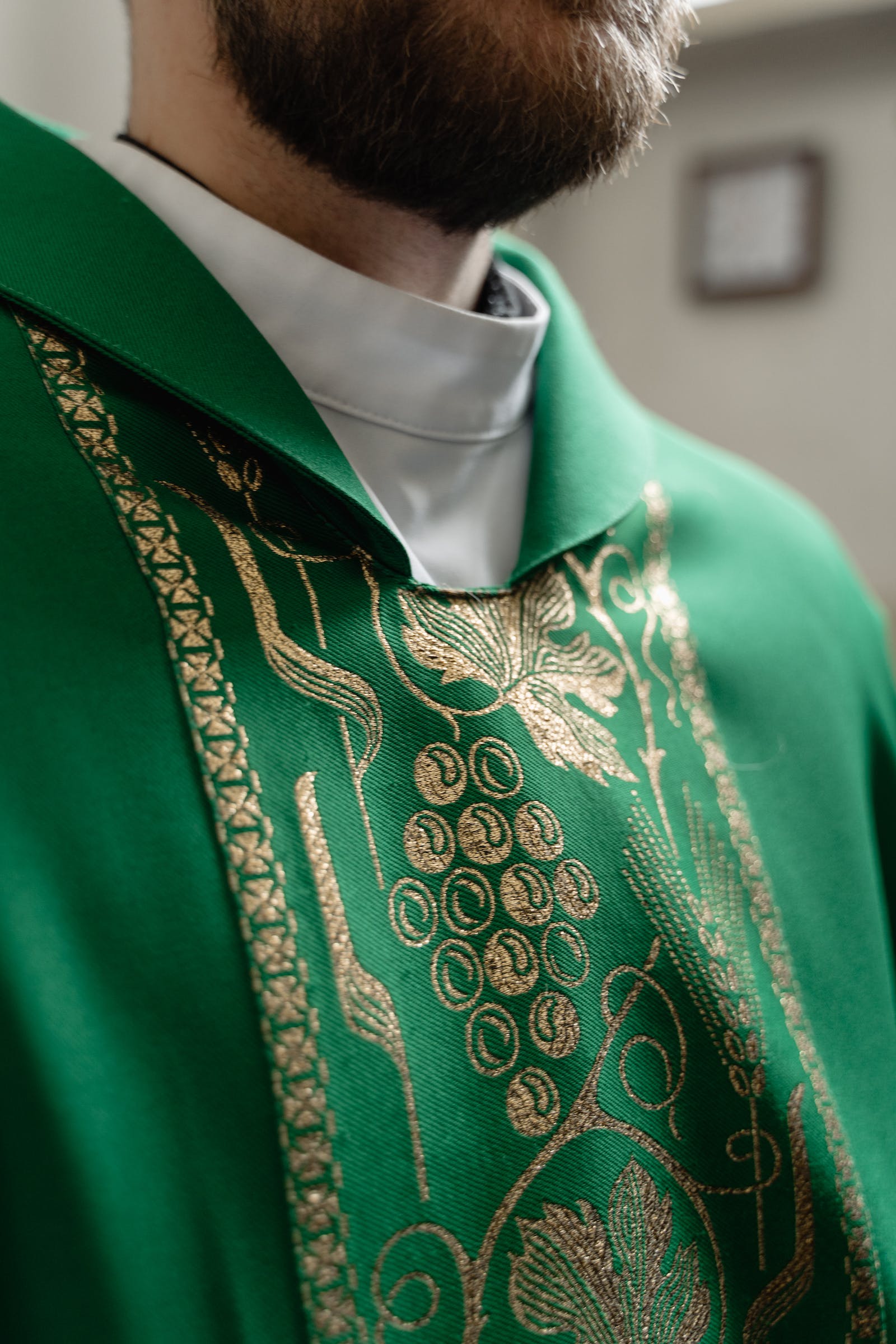 A Person Wearing a Green Vestment
