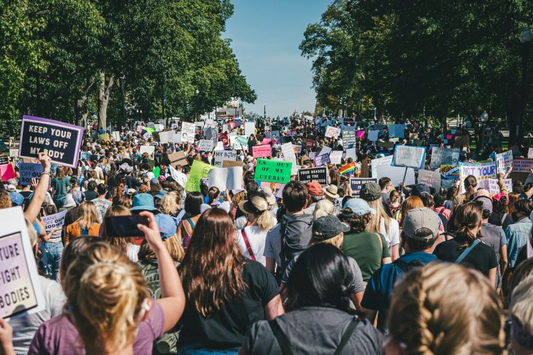 a large group of people holding up signs