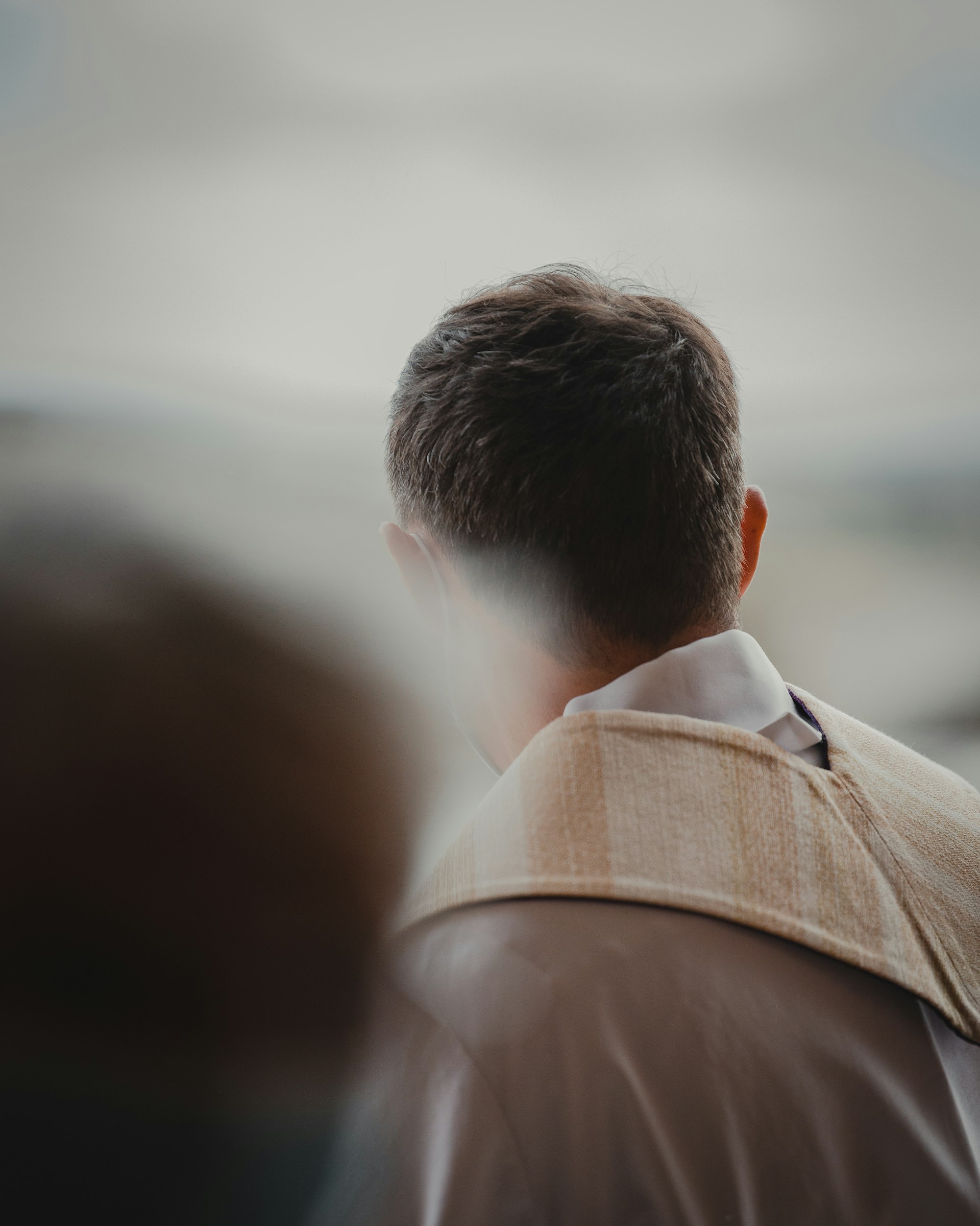 man in brown collared shirt